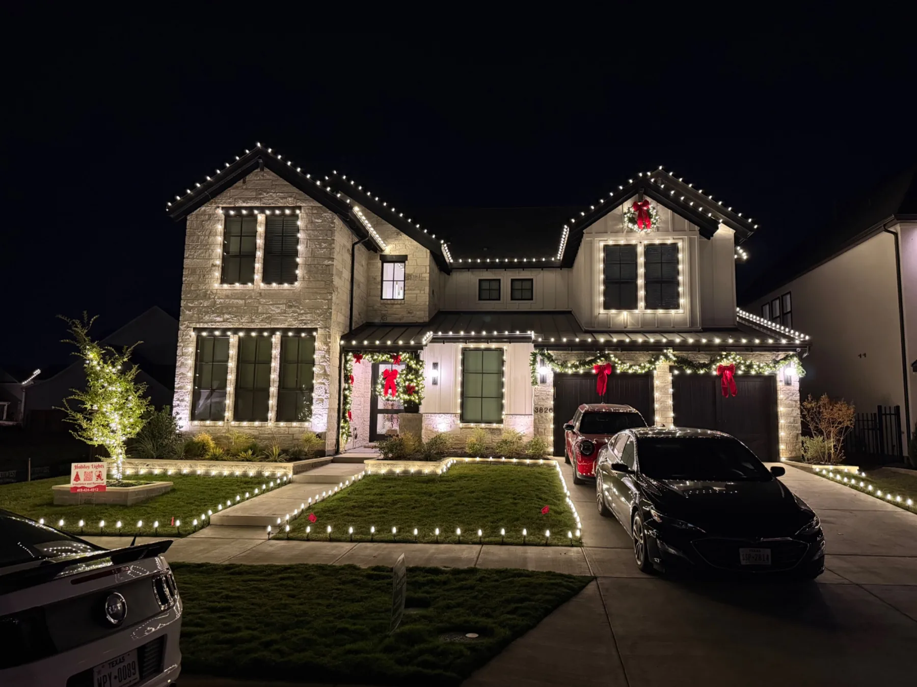 Professional holiday display with wreaths and garland